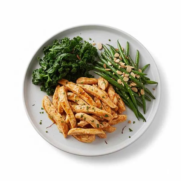 Signature Saffron-Tomato Chicken paired with Wilted Kale & Haricots Verts Almondine